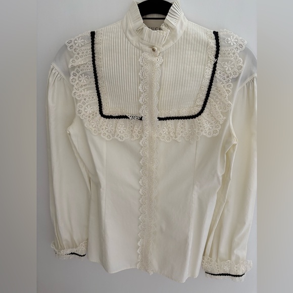 Authentic Gucci off-white with black trim blouse size Euro 38. - Picture 1 of 10